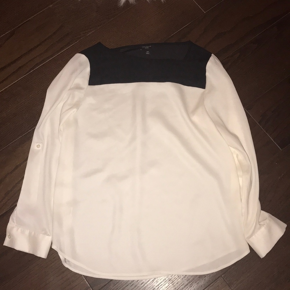White blouse with black shoulder detail